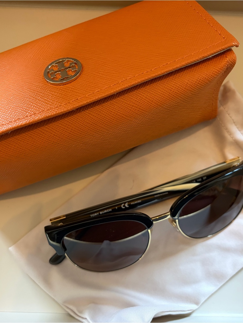 Tory Burch Black and Gold Semi-Rimless Sunglasses with Orange Case